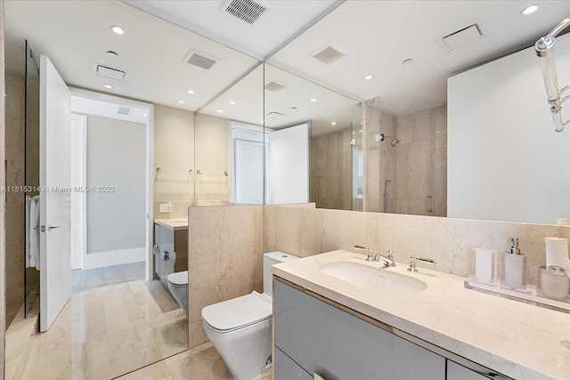 15701 Collins Ave Unit 3101, Sunny Isles Beach, FL 33160 - bathroom featuring vanity, a stall shower, toilet, and recessed lighting
