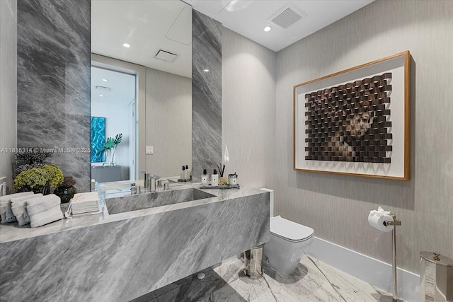 15701 Collins Ave Unit 3101, Sunny Isles Beach, FL 33160 - bathroom featuring toilet, marble finish floors, vanity, and recessed lighting