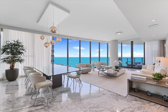 15701 Collins Ave Unit 3101, Sunny Isles Beach, FL 33160 - living room with marble tiled floors, floor to ceiling windows, and a water view