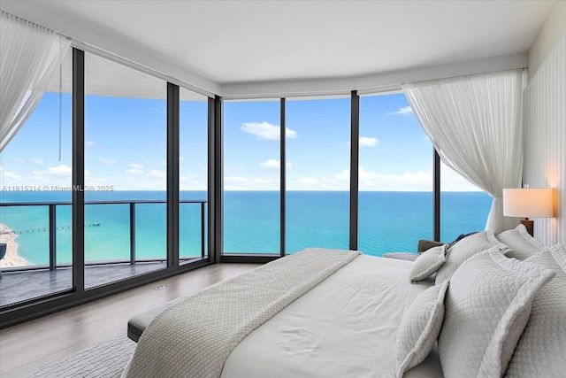 15701 Collins Ave Unit 3101, Sunny Isles Beach, FL 33160 - bedroom with a water view and wood finished floors