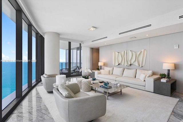 15701 Collins Ave Unit 3101, Sunny Isles Beach, FL 33160 - living room featuring a wall of windows and marble finish floors