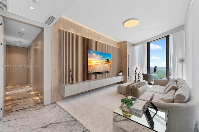 15701 Collins Ave Unit 3101, Sunny Isles Beach, FL 33160 - community lobby featuring wood walls, expansive windows, and recessed lighting