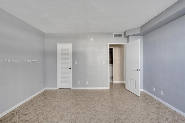 3001 S Ocean Dr Unit 247, Hollywood, FL 33019 - spare room featuring light tile patterned floors and baseboards