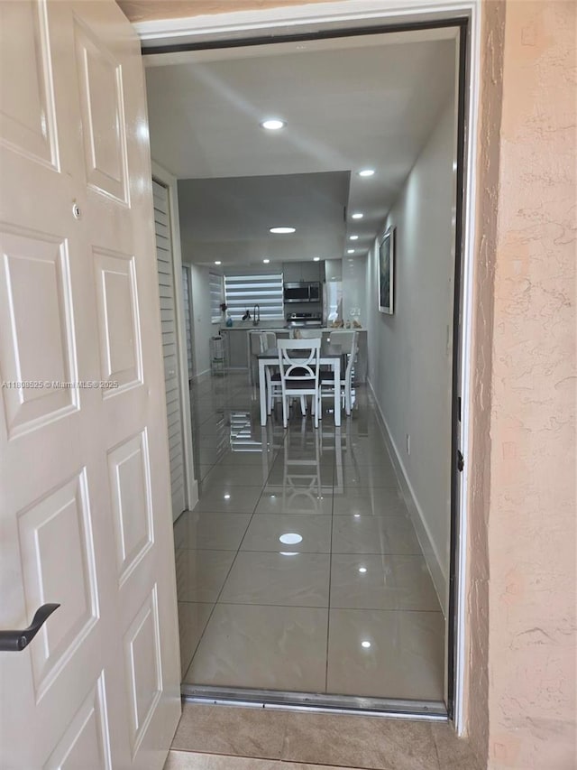 1140 Independence Trl Unit 1140-J, Homestead, FL 33034 - hallway featuring tile patterned floors