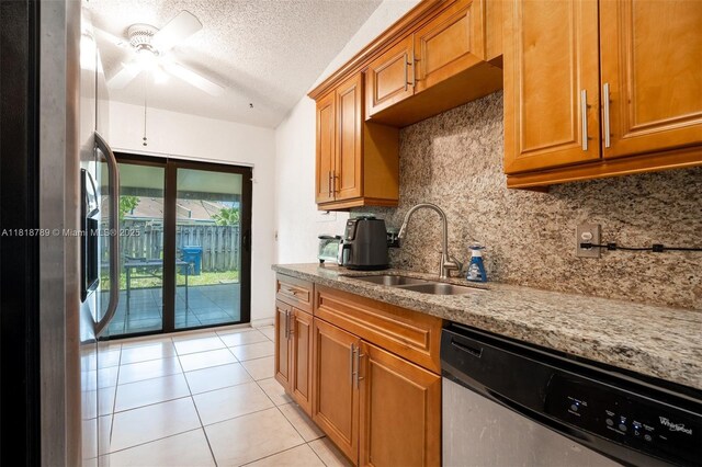 7382 NW 34th St, Lauderhill, FL 33319 - kitchen with stainless steel appliances, a sink, brown cabinetry, tasteful backsplash, and a ceiling fan