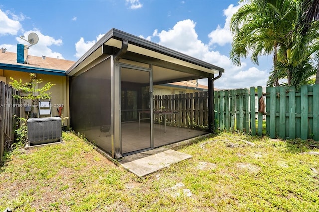 7382 NW 34th St, Lauderhill, FL 33319 - view of yard featuring central air condition unit and a sunroom