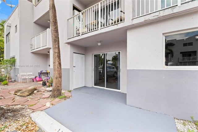2660 W 76th St Unit 106, Hialeah, FL 33016 - property entrance with stucco siding and a patio