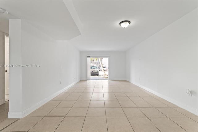 2660 W 76th St Unit 106, Hialeah, FL 33016 - empty room featuring light tile patterned floors and baseboards