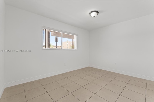 2660 W 76th St Unit 106, Hialeah, FL 33016 - empty room featuring baseboards and light tile patterned floors