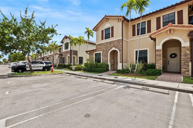 9362 W 33rd Ln, Hialeah, FL 33018 - view of front of home with stone siding, uncovered parking, and stucco siding