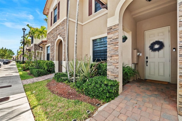 9362 W 33rd Ln, Hialeah, FL 33018 - doorway to property with stone siding and stucco siding