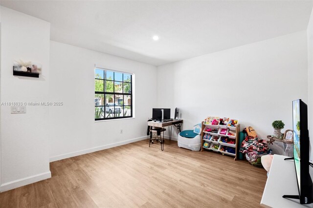 9362 W 33rd Ln, Hialeah, FL 33018 - playroom with wood finished floors, baseboards, a desk, and recessed lighting