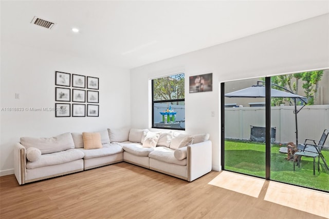 9362 W 33rd Ln, Hialeah, FL 33018 - living room featuring light wood-style flooring, recessed lighting, and baseboards
