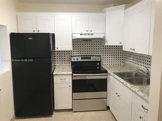 600 Village Green Ct Unit 222, Palm Springs, FL 33461 - kitchen with freestanding refrigerator, stainless steel electric range, under cabinet range hood, and white cabinetry