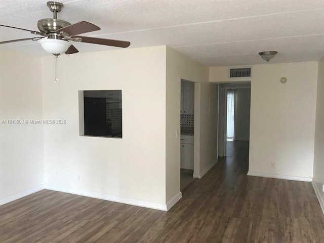 600 Village Green Ct Unit 222, Palm Springs, FL 33461 - unfurnished room with wood finished floors, ceiling fan, and a textured ceiling