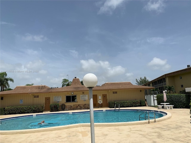 600 Village Green Ct Unit 222, Palm Springs, FL 33461 - community pool featuring a patio