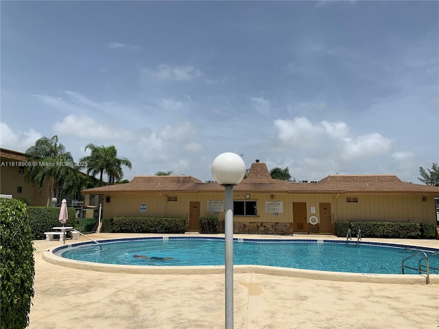 600 Village Green Ct Unit 222, Palm Springs, FL 33461 - community pool featuring a patio area