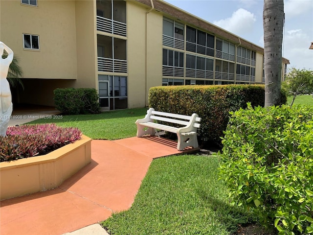 600 Village Green Ct Unit 222, Palm Springs, FL 33461 - surrounding community featuring a lawn