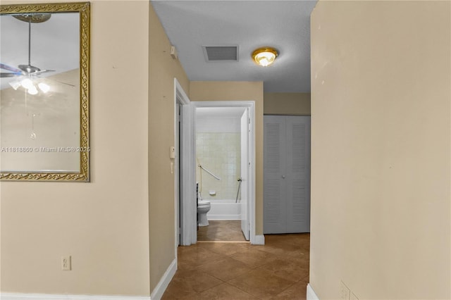 8663 Spring Valley Dr, Boynton Beach, FL 33472 - hallway featuring tile patterned flooring and baseboards