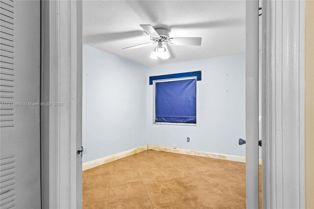 8663 Spring Valley Dr, Boynton Beach, FL 33472 - tiled spare room featuring baseboards and ceiling fan