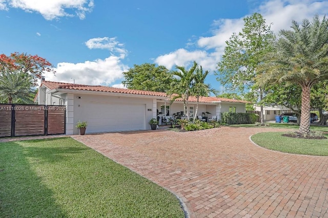 8005 SW 89th St, Miami, FL 33156 - view of front of property featuring decorative driveway, stucco siding, a garage, a tile roof, and a gate