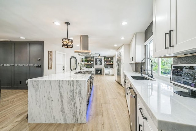 8005 SW 89th St, Miami, FL 33156 - kitchen with island range hood, recessed lighting, light wood-style floors, white cabinets, and an island with sink