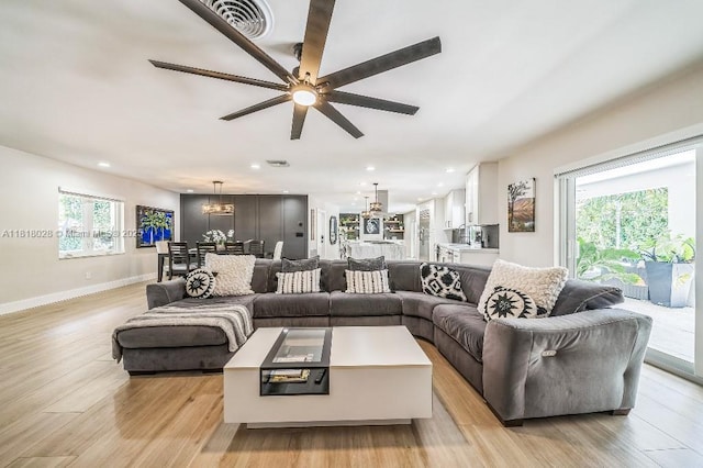 8005 SW 89th St, Miami, FL 33156 - living area with ceiling fan, light wood-style floors, recessed lighting, and a chandelier