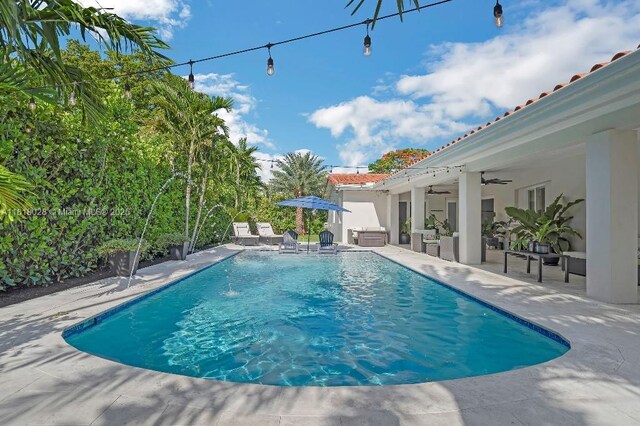 8005 SW 89th St, Miami, FL 33156 - swimming pool featuring ceiling fan, a patio area, and an outdoor hangout area