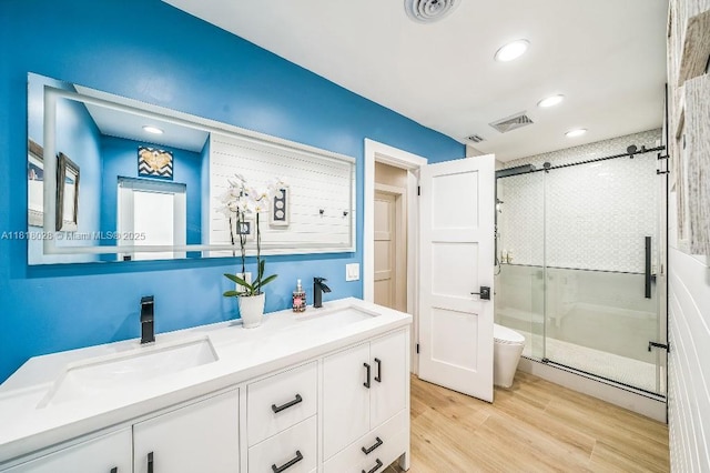 8005 SW 89th St, Miami, FL 33156 - full bathroom featuring a shower stall, double vanity, wood finished floors, and recessed lighting