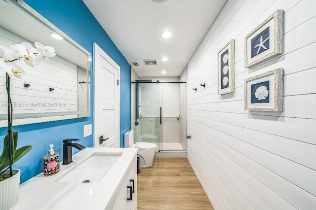 8005 SW 89th St, Miami, FL 33156 - bathroom featuring a shower stall, recessed lighting, vanity, wood finished floors, and wood walls