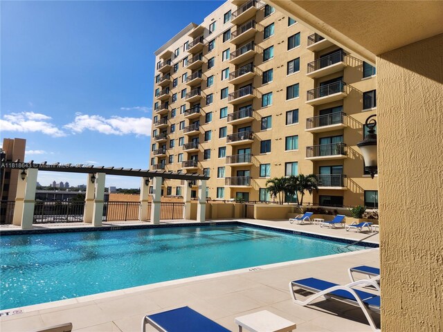 4242 NW 2nd St Unit 1202, Miami, FL 33126 - community pool with a patio