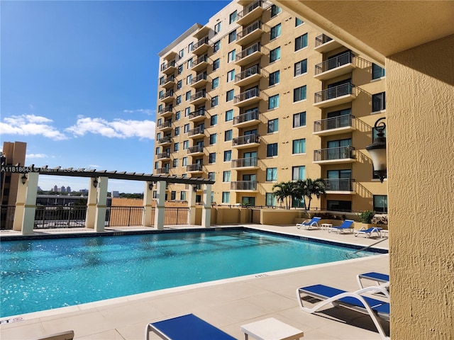 4242 NW 2nd St Unit 1202, Miami, FL 33126 - community pool featuring a patio
