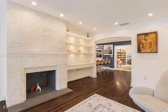 261 SW 30th Rd, Miami, FL 33129 - living area with arched walkways, wood finished floors, recessed lighting, baseboards, and built in shelves