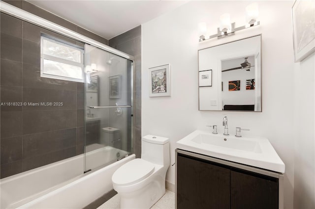 261 SW 30th Rd, Miami, FL 33129 - bathroom with vanity, toilet, bath / shower combo with glass door, and a ceiling fan