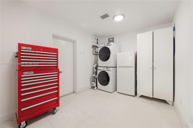 261 SW 30th Rd, Miami, FL 33129 - washroom with stacked washer / drying machine and baseboards