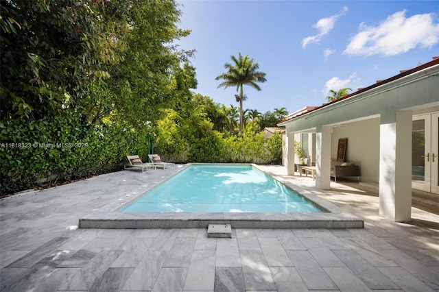261 SW 30th Rd, Miami, FL 33129 - outdoor pool with a patio and french doors