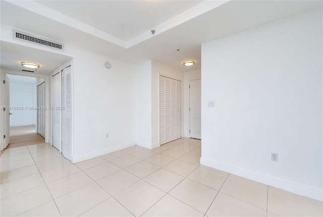 2400 SW 27th Ave Unit 402, Miami, FL 33145 - empty room with baseboards and light tile patterned flooring