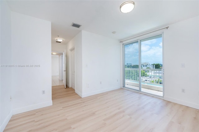 2400 SW 27th Ave Unit 402, Miami, FL 33145 - unfurnished room with light wood-type flooring