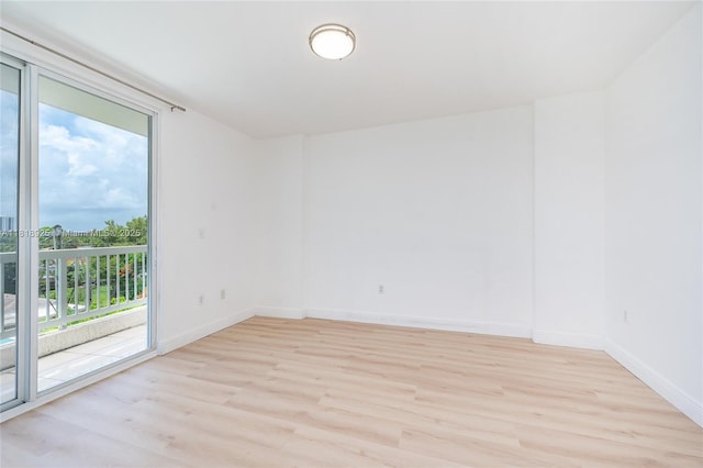 2400 SW 27th Ave Unit 402, Miami, FL 33145 - empty room featuring light wood-style flooring and baseboards