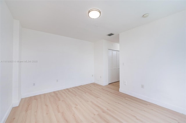 2400 SW 27th Ave Unit 402, Miami, FL 33145 - empty room featuring light wood finished floors and a smoke detector