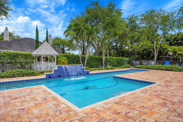 6129 SW 74th Ct, Miami, FL 33143 - view of swimming pool with a gazebo and a patio