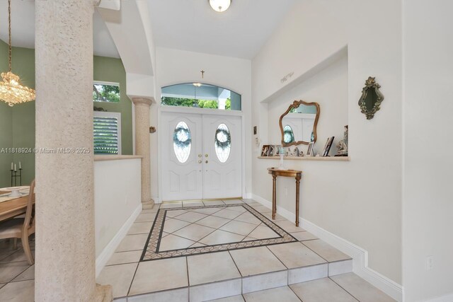 6129 SW 74th Ct, Miami, FL 33143 - foyer featuring tile patterned floors and a chandelier