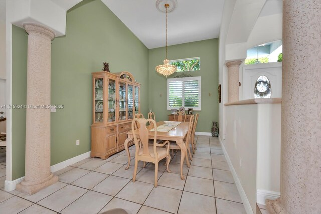 6129 SW 74th Ct, Miami, FL 33143 - dining space featuring decorative columns, light tile patterned floors, and a high ceiling