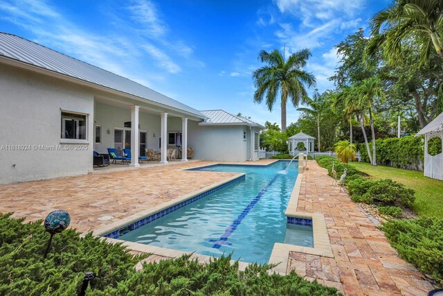 6129 SW 74th Ct, Miami, FL 33143 - view of swimming pool featuring a patio area and a gazebo