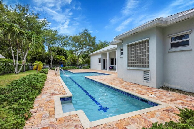 6129 SW 74th Ct, Miami, FL 33143 - view of swimming pool with a patio