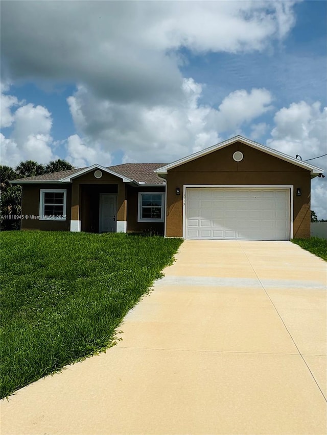 1115 Leader St, La Belle, FL 33935 - ranch-style house featuring driveway, stucco siding, an attached garage, and a front yard