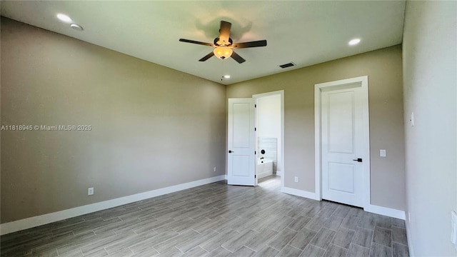 1115 Leader St, La Belle, FL 33935 - unfurnished bedroom featuring baseboards, wood finished floors, recessed lighting, ceiling fan, and connected bathroom