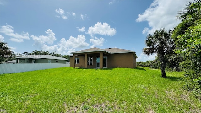 1115 Leader St, La Belle, FL 33935 - back of house featuring stucco siding