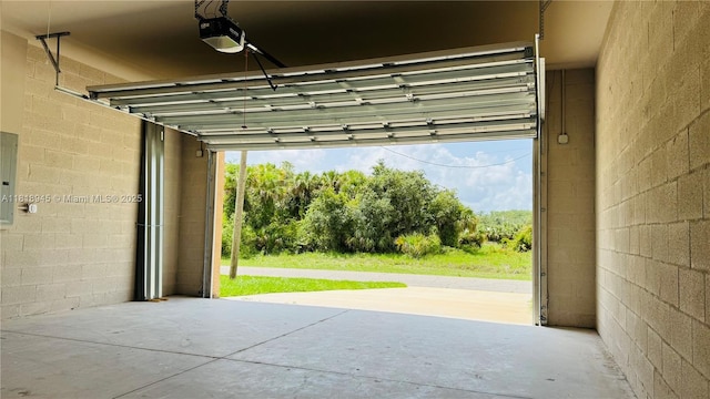 1115 Leader St, La Belle, FL 33935 - garage featuring a garage door opener and electric panel