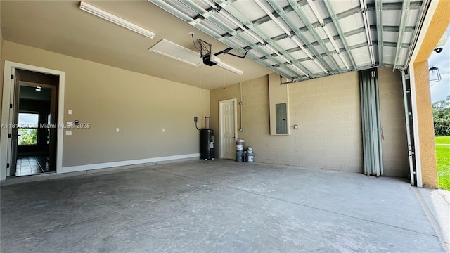 1115 Leader St, La Belle, FL 33935 - garage featuring electric panel, a garage door opener, and water heater